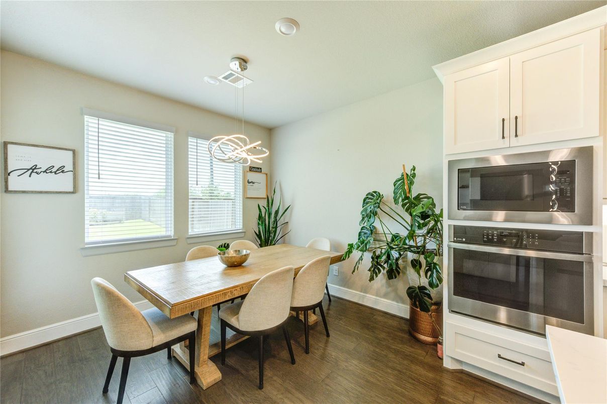 Dining room, Interior, Pendant Lights, Recessed Lighting, Stainless Steel Appliances, Wood Texture Flooring