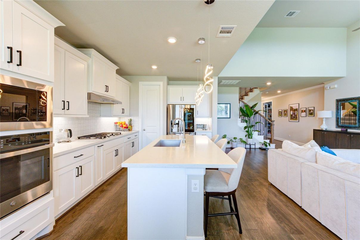 Dining room, Interior, Kitchen, Pendant Lights, Recessed Lighting, Stainless Steel Appliances, Wood Texture Flooring