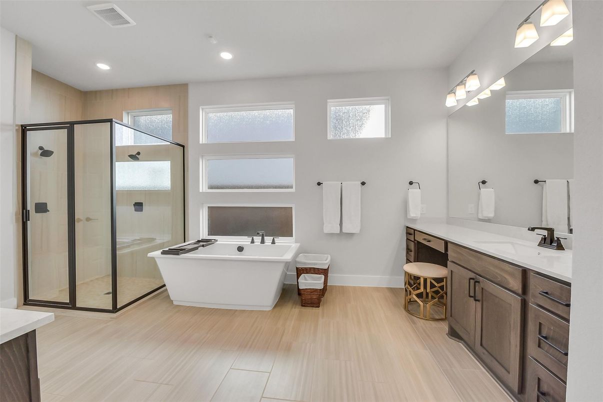 Bathroom, Dual Sink Vanities, Free Standing Baths, Glass Shower, Interior, Recessed Lighting, Wood Texture Flooring
