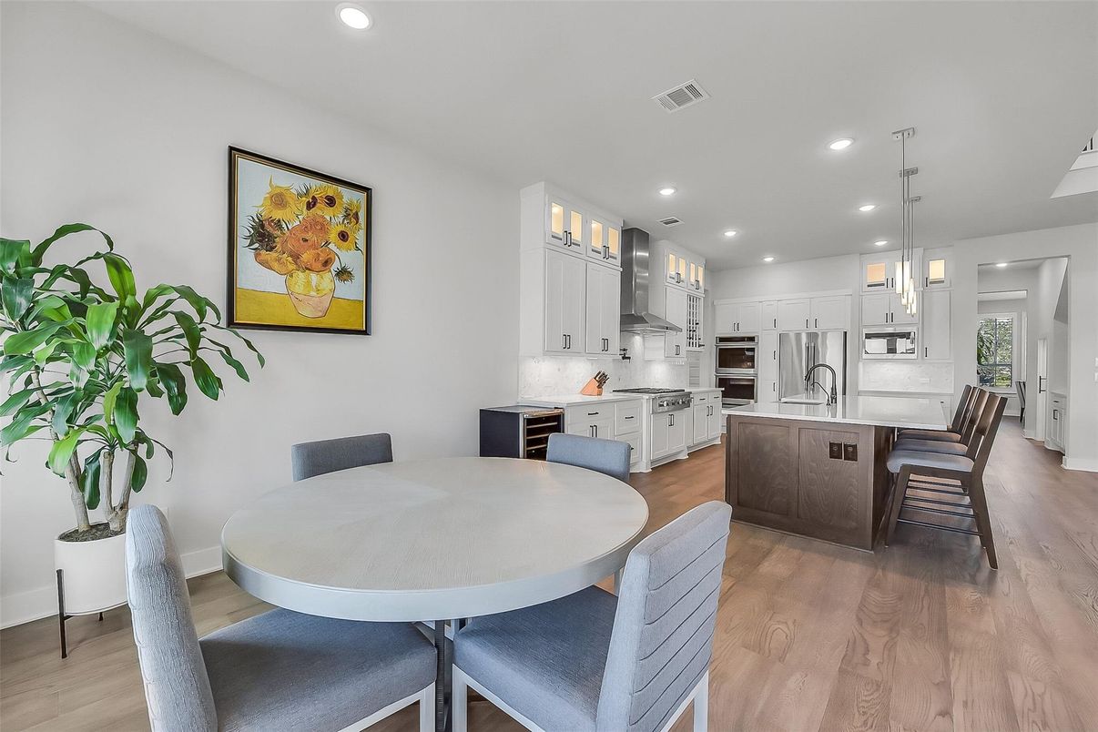 Dining room, Interior, Kitchen, Pendant Lights, Recessed Lighting, Stainless Steel Appliances, Wood Texture Flooring