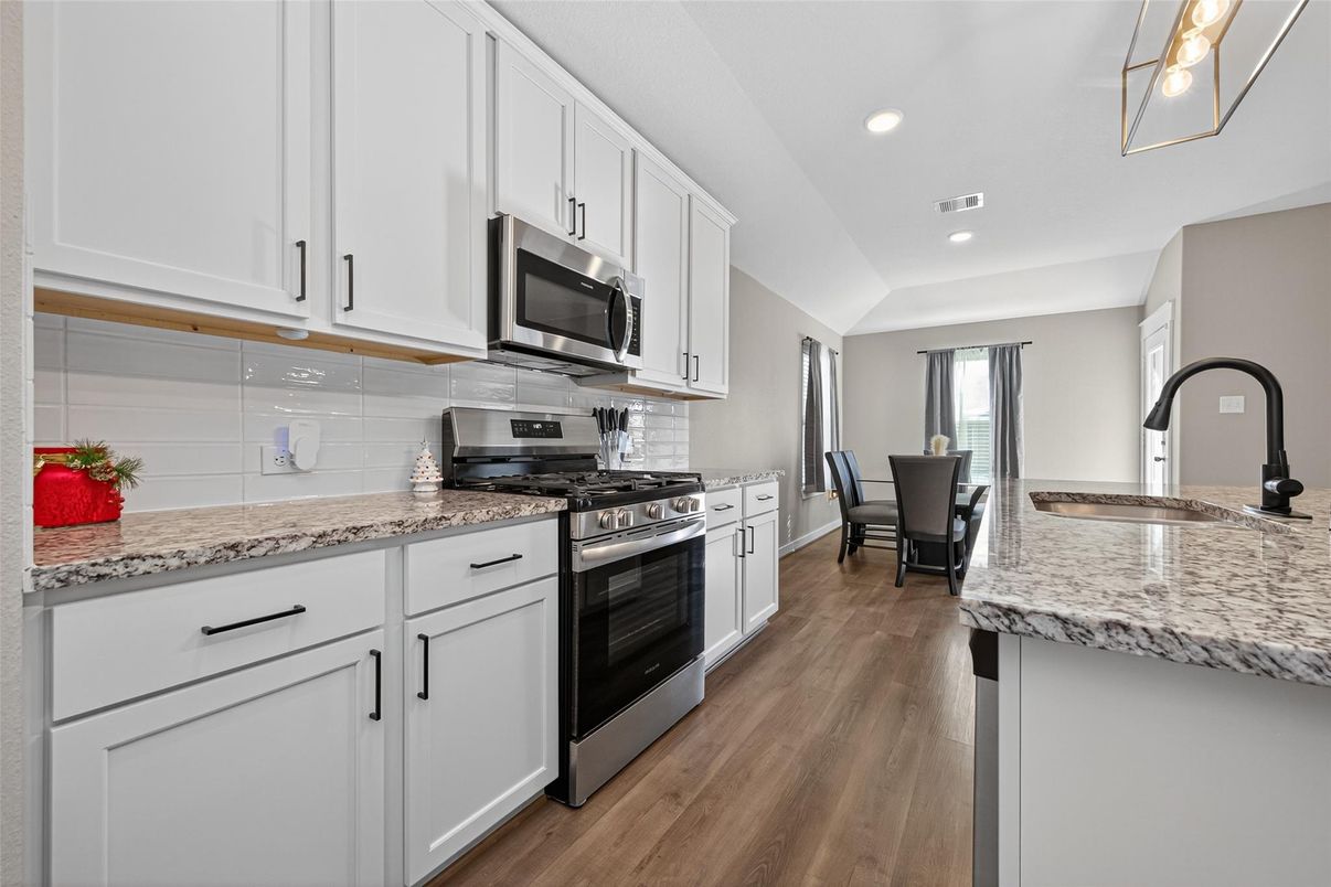 Dining room, Interior, Kitchen, Recessed Lighting, Stainless Steel Appliances, Wood Texture Flooring