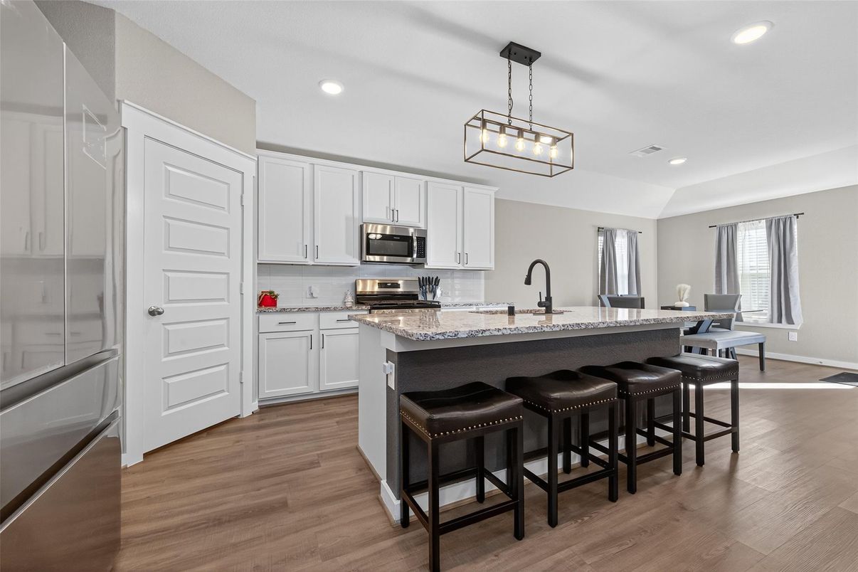 Dining room, Interior, Kitchen, Pendant Lights, Recessed Lighting, Stainless Steel Appliances, Wood Texture Flooring