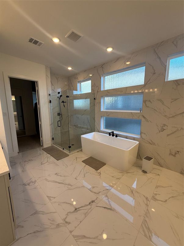 Bathroom, Free Standing Baths, Glass Shower, Interior, Marble, Marble Walls, Recessed Lighting