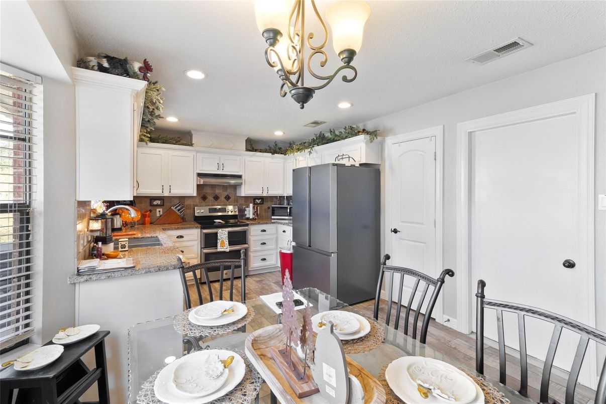 Dining room, Interior, Kitchen, Recessed Lighting, Stainless Steel Appliances, Wood Texture Flooring