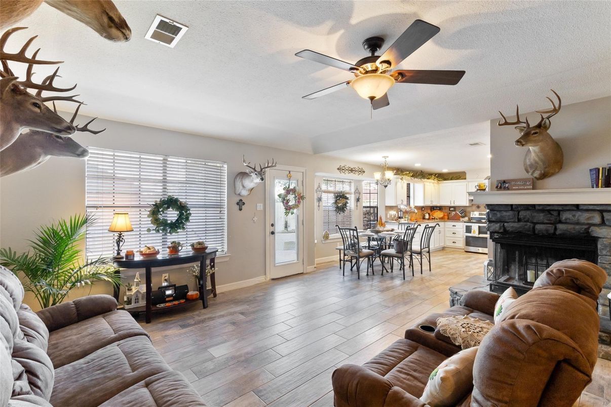 Chandelier, Dining room, Fireplace, Interior, Kitchen, Living room, Wood Texture Flooring