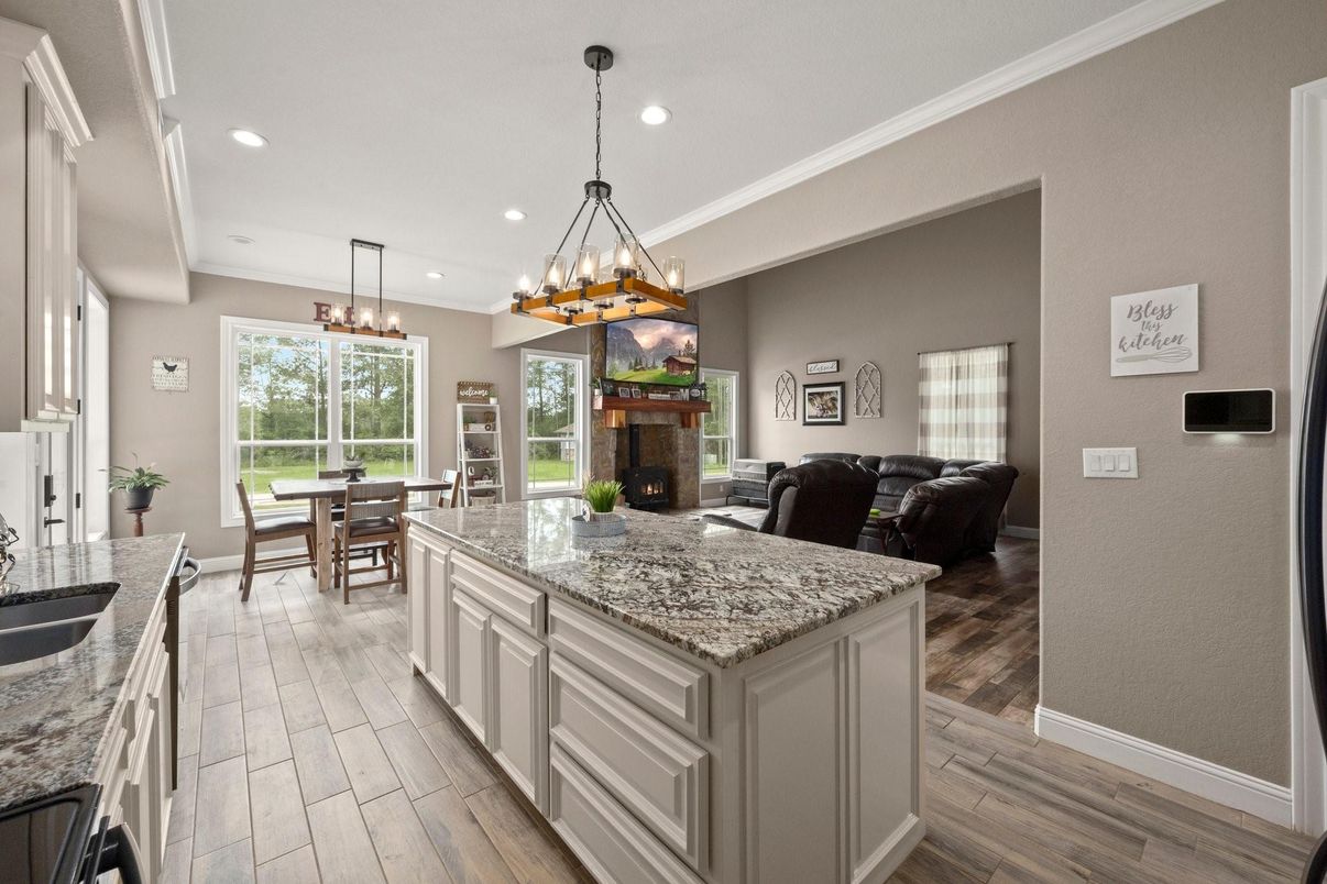 Chandelier, Dining room, Fireplace, Interior, Living room, Pendant Lights, Recessed Lighting, Wood Texture Flooring