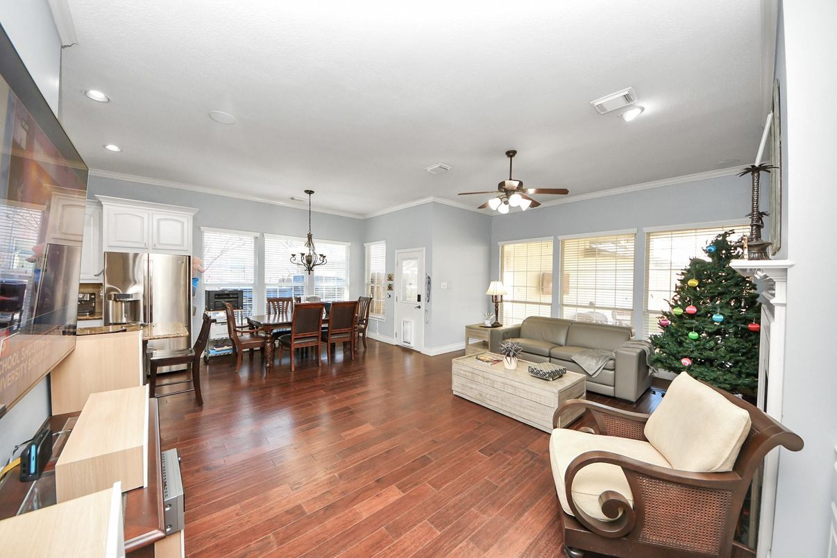 Chandelier, Dining room, Fireplace, Interior, Kitchen, Living room, Recessed Lighting, Stainless Steel Appliances, Wood Texture Flooring