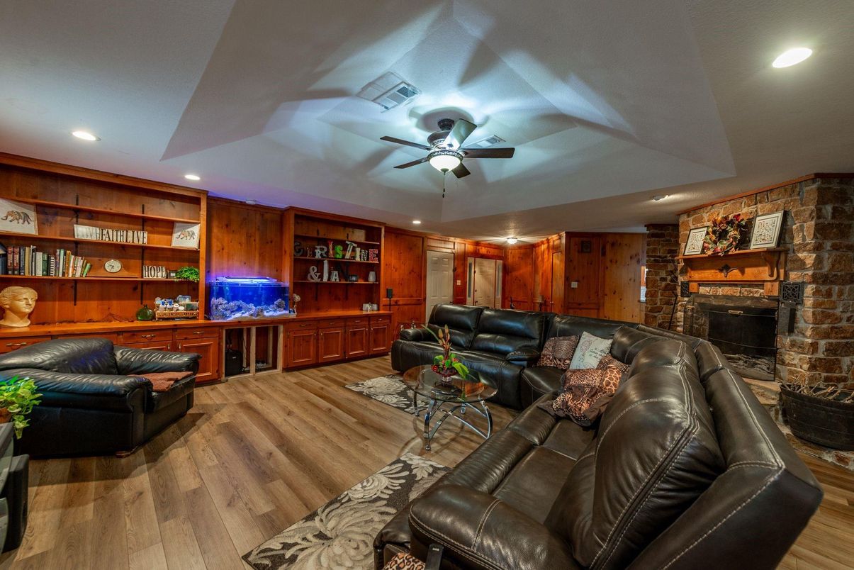 Fireplace, Interior, Living room, Recessed Lighting, Stone Walls, Wood Texture Flooring, Wooden Walls