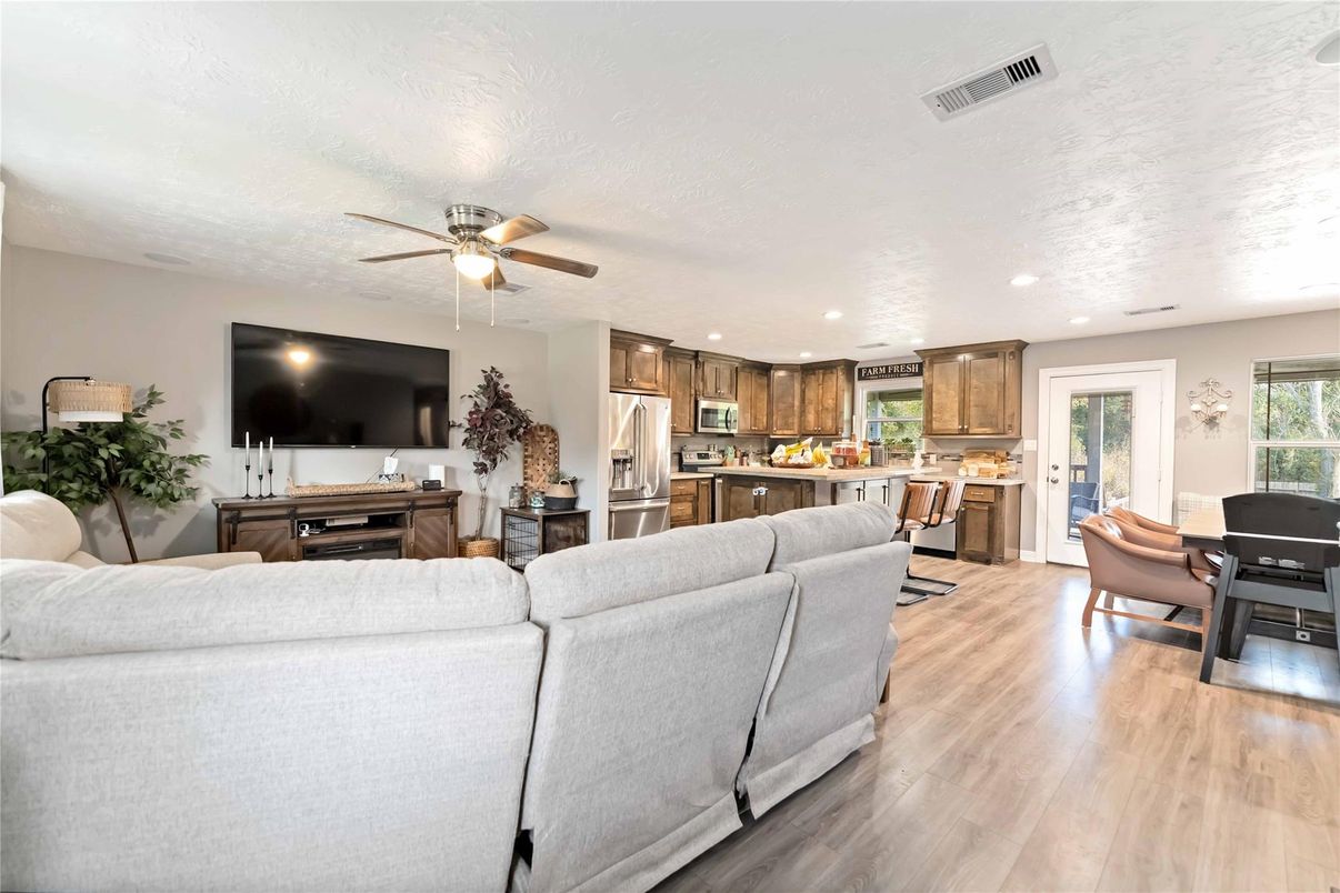 Dining room, Interior, Kitchen, Living room, Recessed Lighting, Stainless Steel Appliances, Wood Texture Flooring