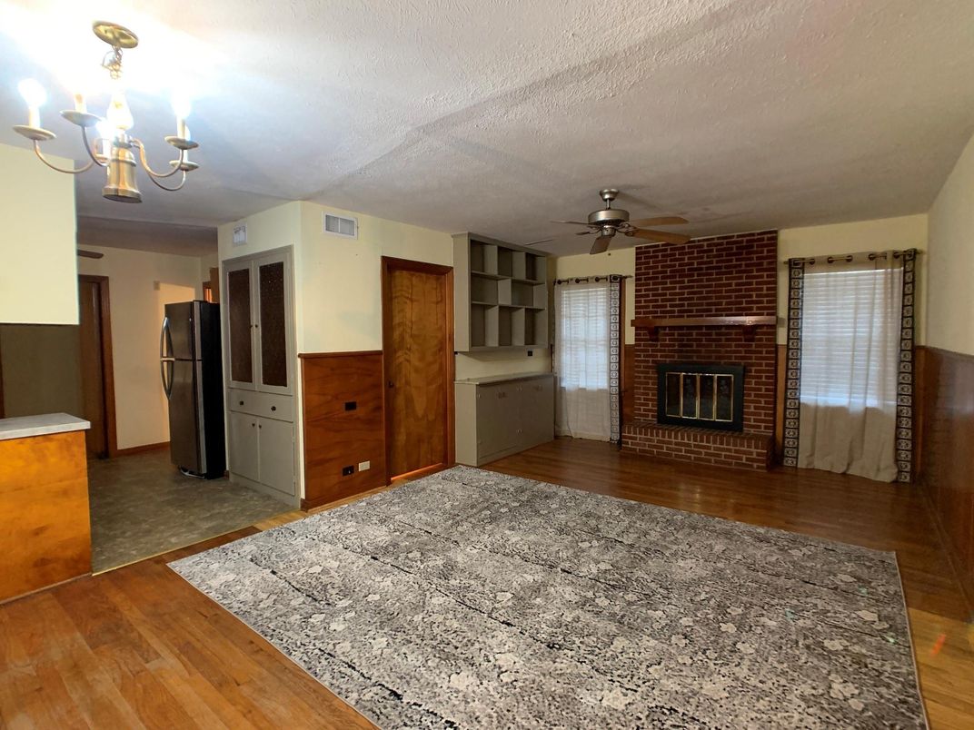 Chandelier, Empty room, Fireplace, Interior, Stone Walls, Wood Texture Flooring