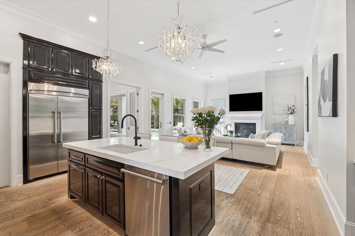 Chandelier, Fireplace, Interior, Kitchen, Living room, Recessed Lighting, Stainless Steel Appliances, Wood Texture Flooring