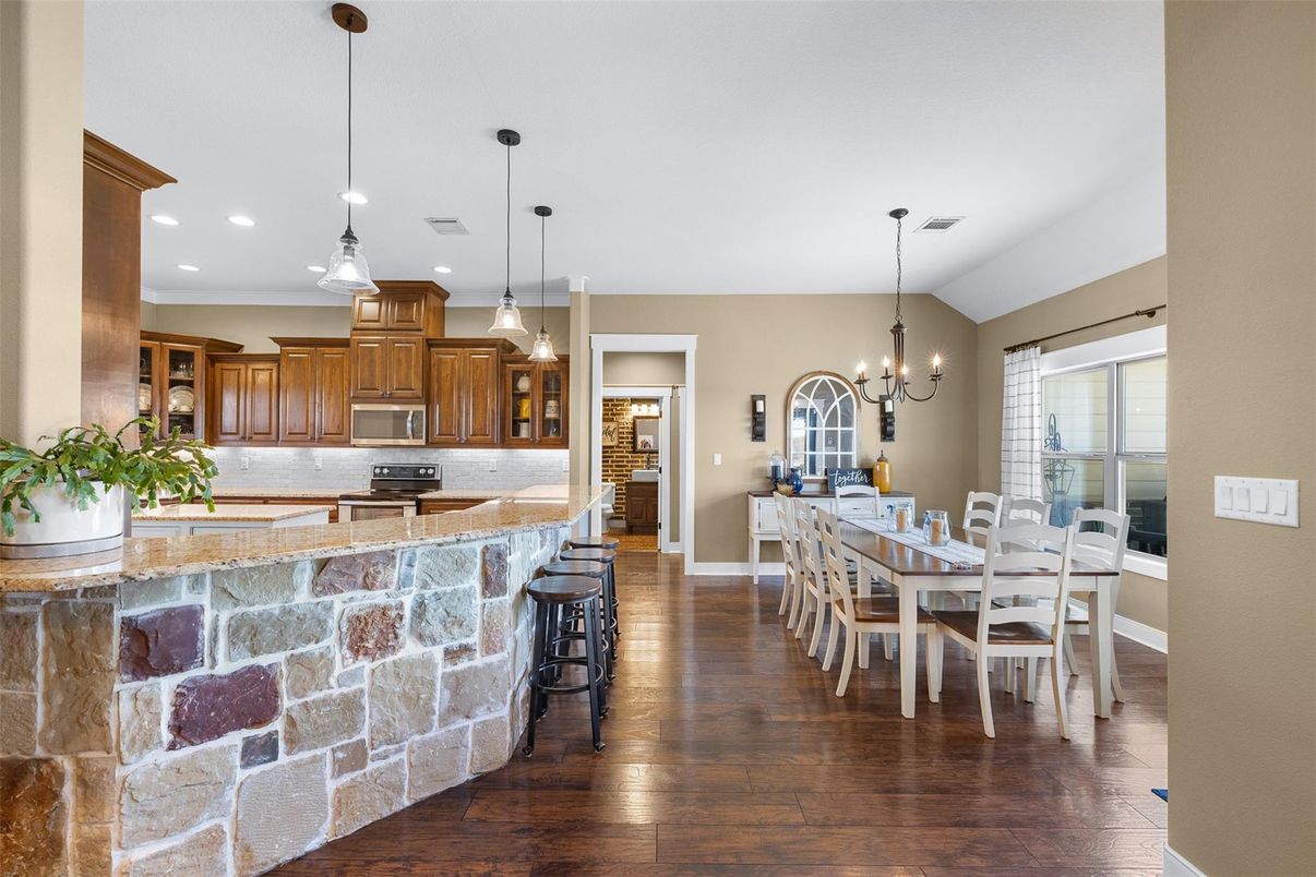 Chandelier, Dining room, Interior, Kitchen, Pendant Lights, Recessed Lighting, Stainless Steel Appliances, Wood Texture Flooring