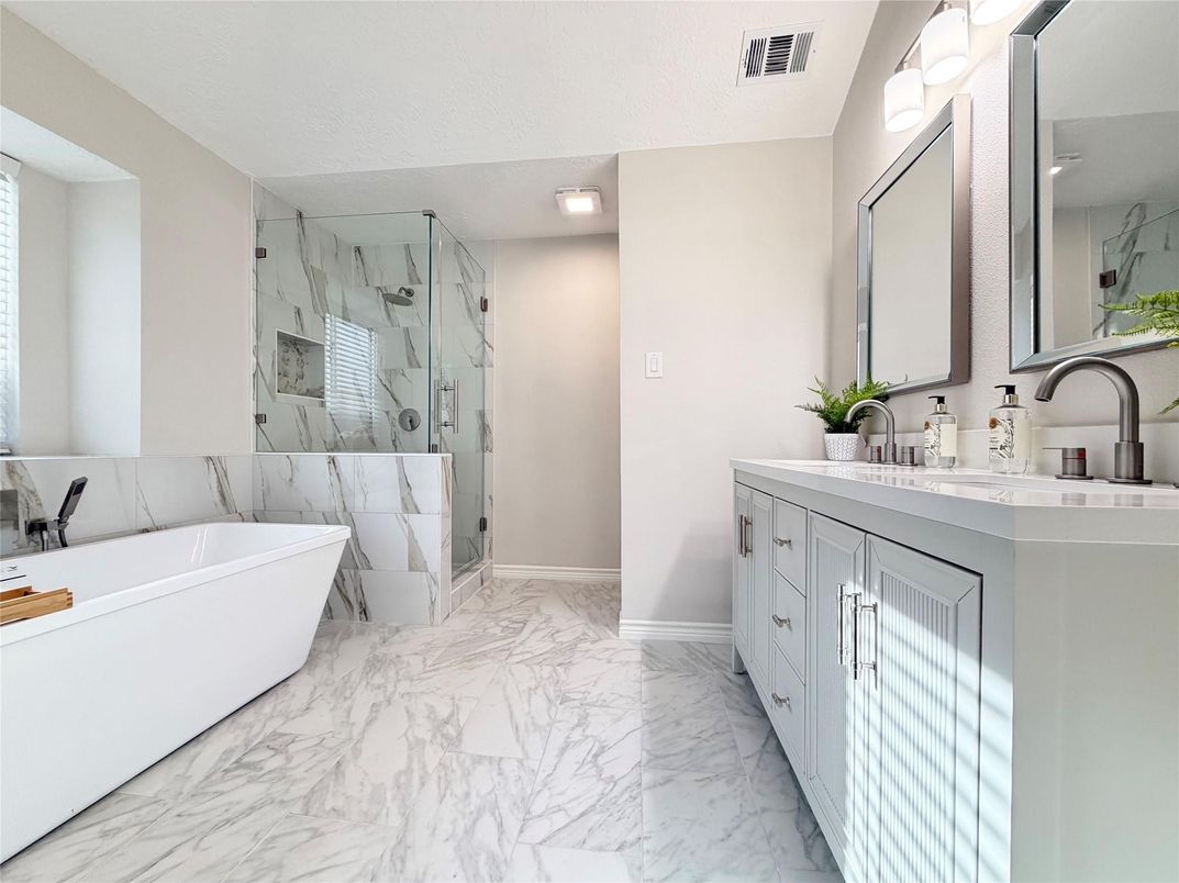 Bathroom, Dual Sink Vanities, Free Standing Baths, Glass Shower, Interior, Marble, Marble Walls, Recessed Lighting