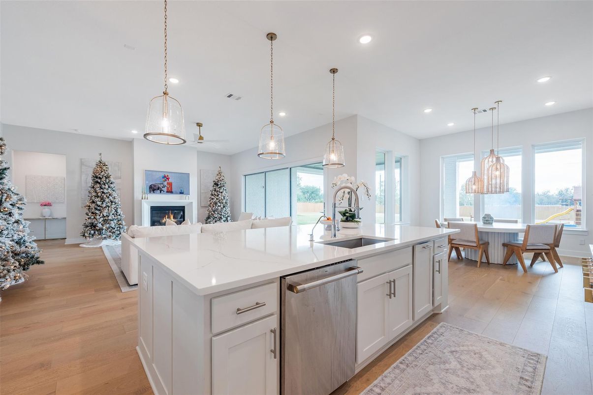 Chandelier, Dining room, Fireplace, Interior, Kitchen, Living room, Pendant Lights, Recessed Lighting, Wood Texture Flooring