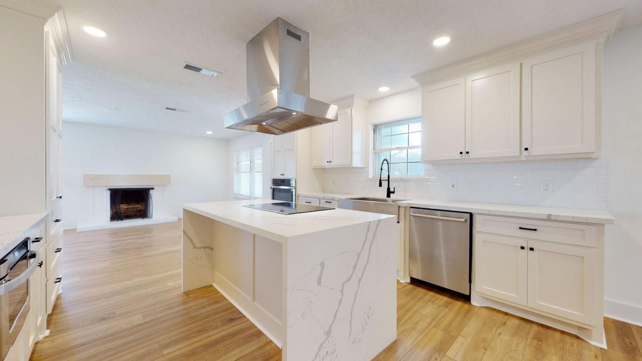 Fireplace, Interior, Kitchen, Recessed Lighting, Stainless Steel Appliances, Wood Texture Flooring