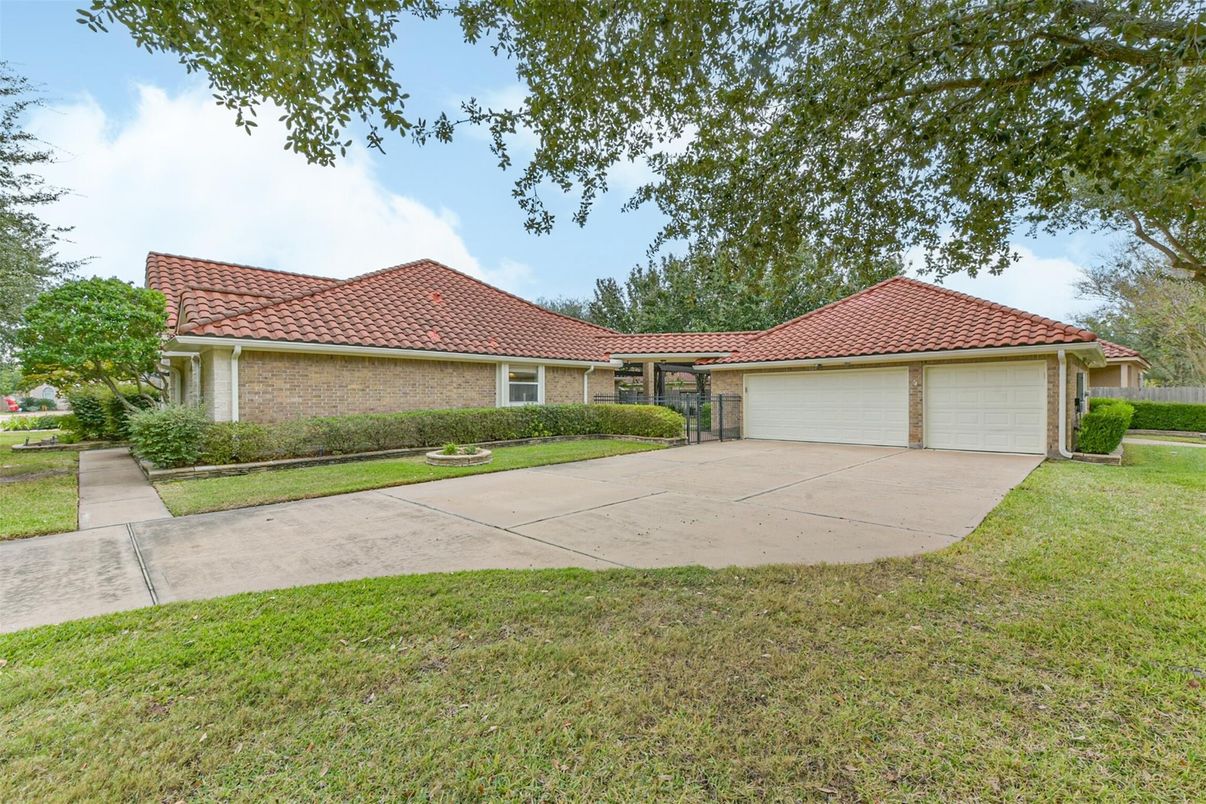 Attached, Backyard, Exterior, Facade, Brick Facade, Mediterranean