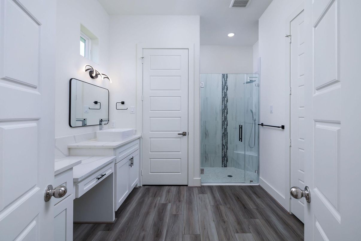 Bathroom, Dual Sink Vanities, Glass Shower, Interior, Recessed Lighting, Wood Texture Flooring