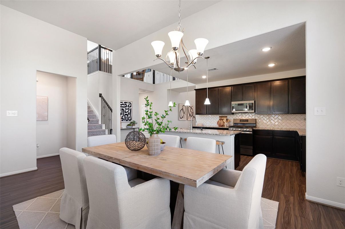 Chandelier, Dining room, Interior, Kitchen, Pendant Lights, Recessed Lighting, Stainless Steel Appliances, Wood Texture Flooring