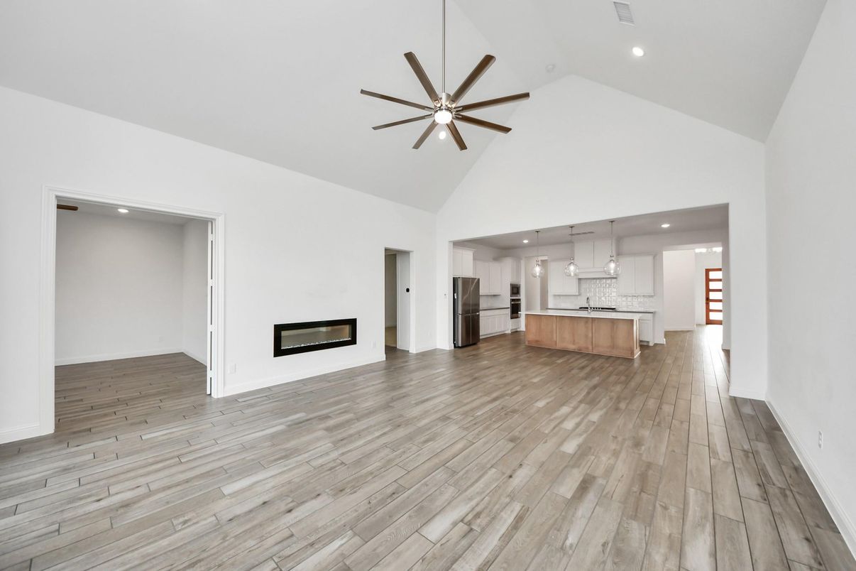 Empty room, Fireplace, Interior, Kitchen, Pendant Lights, Recessed Lighting, Wood Texture Flooring