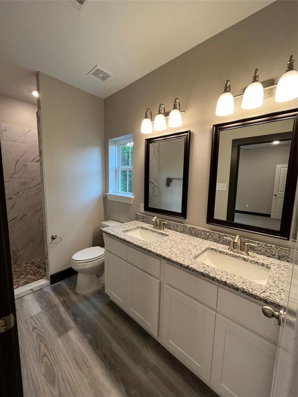 Bathroom, Dual Sink Vanities, Glass Shower, Interior, Marble Walls, Wood Texture Flooring