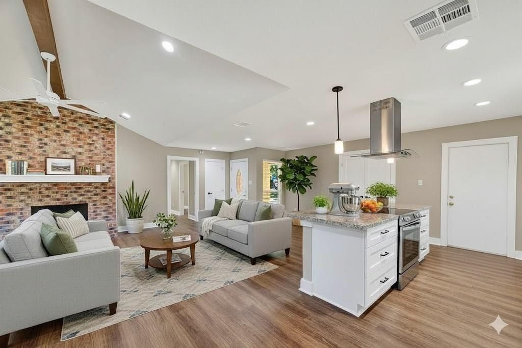 Fireplace, Interior, Kitchen, Living room, Pendant Lights, Recessed Lighting, Stainless Steel Appliances, Stone Walls, Wood Texture Flooring