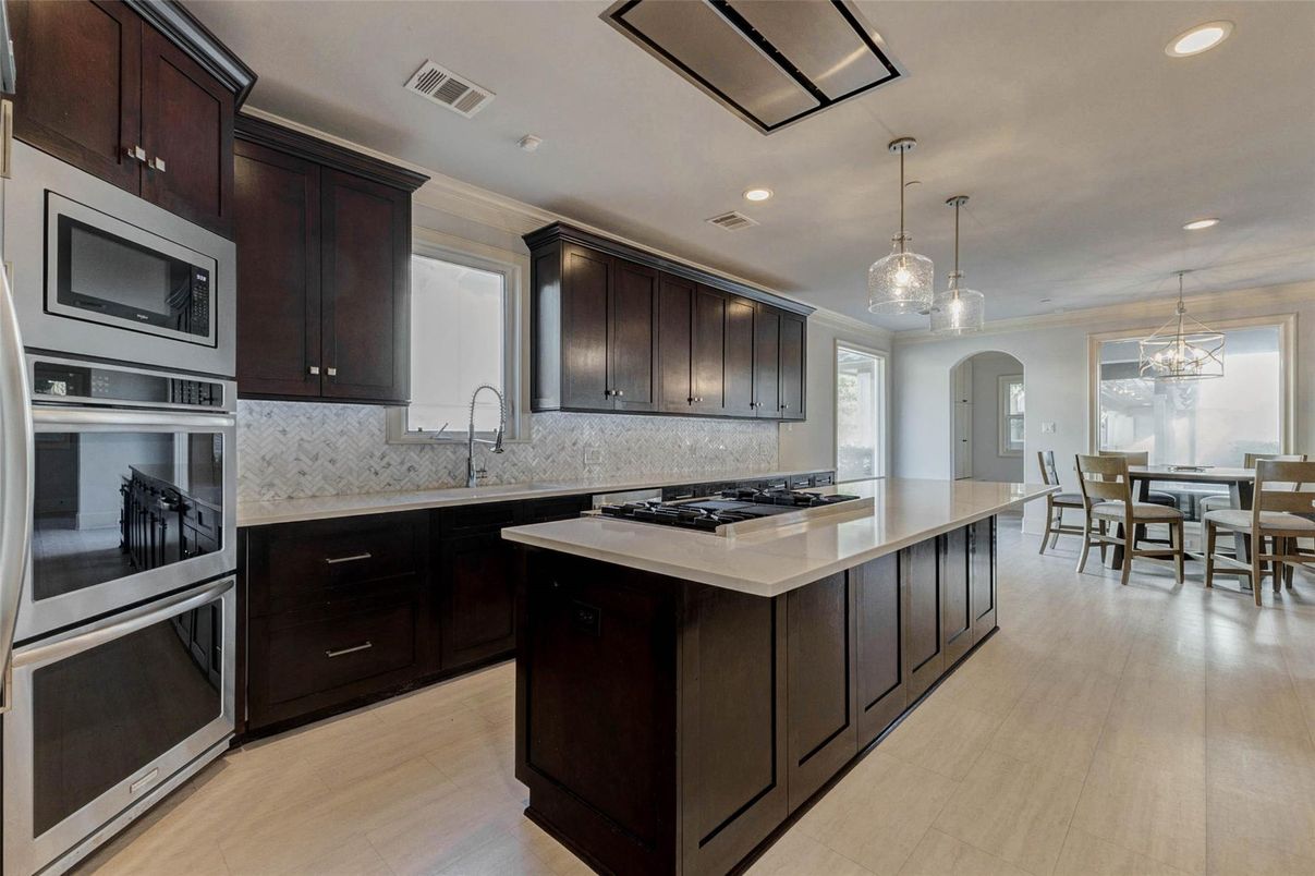 Dining room, Interior, Kitchen, Pendant Lights, Recessed Lighting, Stainless Steel Appliances, Wood Texture Flooring