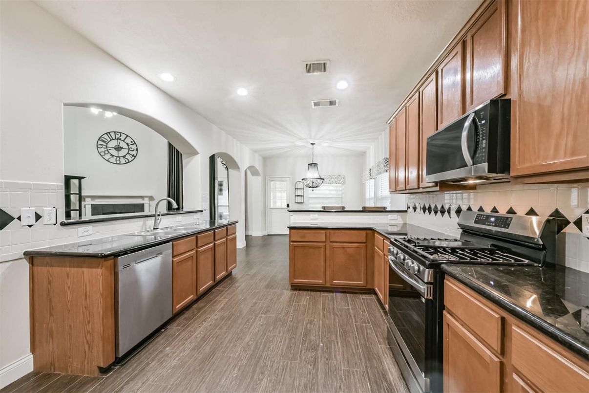 Interior, Kitchen, Pendant Lights, Recessed Lighting, Stainless Steel Appliances, Wood Texture Flooring