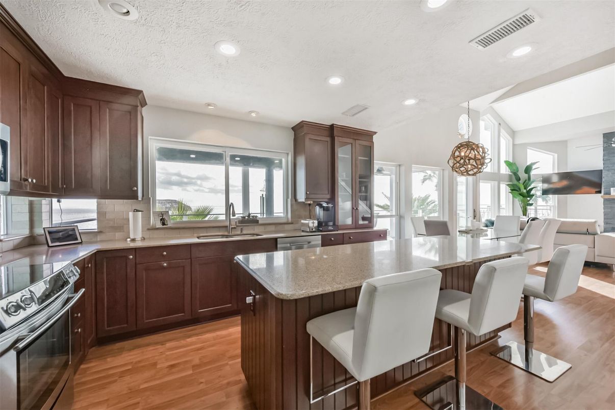 Dining room, Interior, Kitchen, Pendant Lights, Recessed Lighting, Stainless Steel Appliances, Wood Texture Flooring