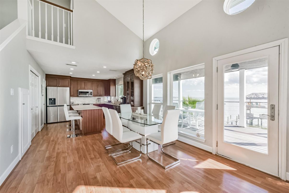 Dining room, Interior, Kitchen, Pendant Lights, Recessed Lighting, Stainless Steel Appliances, Water, Wood Texture Flooring