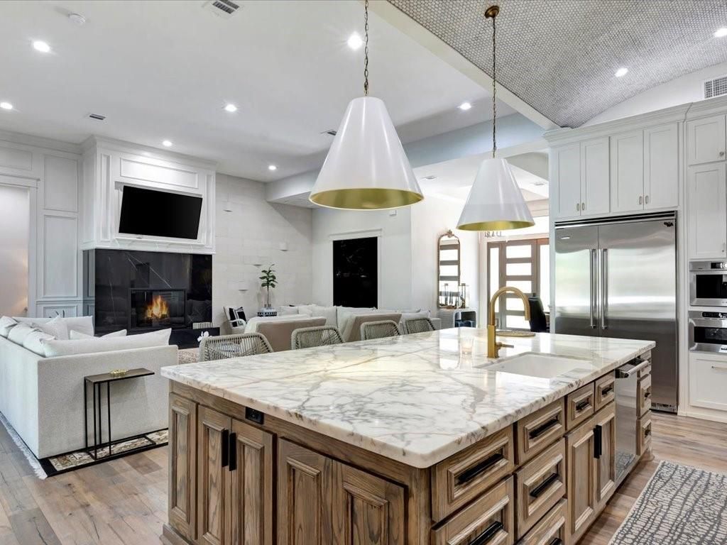 Fireplace, Interior, Kitchen, Living room, Pendant Lights, Recessed Lighting, Stainless Steel Appliances, Wood Texture Flooring