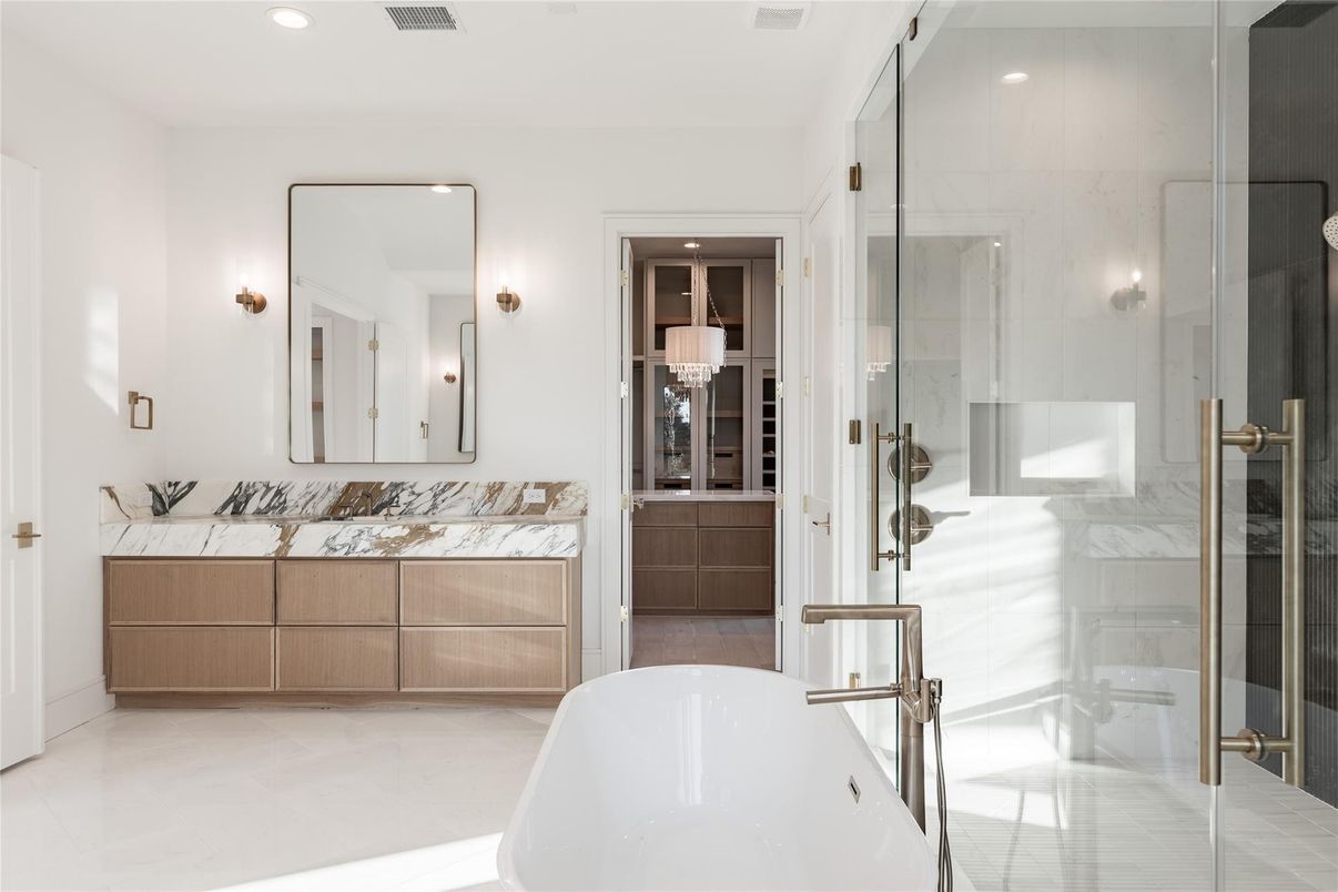 Bathroom, Dual Sink Vanities, Free Standing Baths, Glass Shower, Interior, Marble Walls, Recessed Lighting
