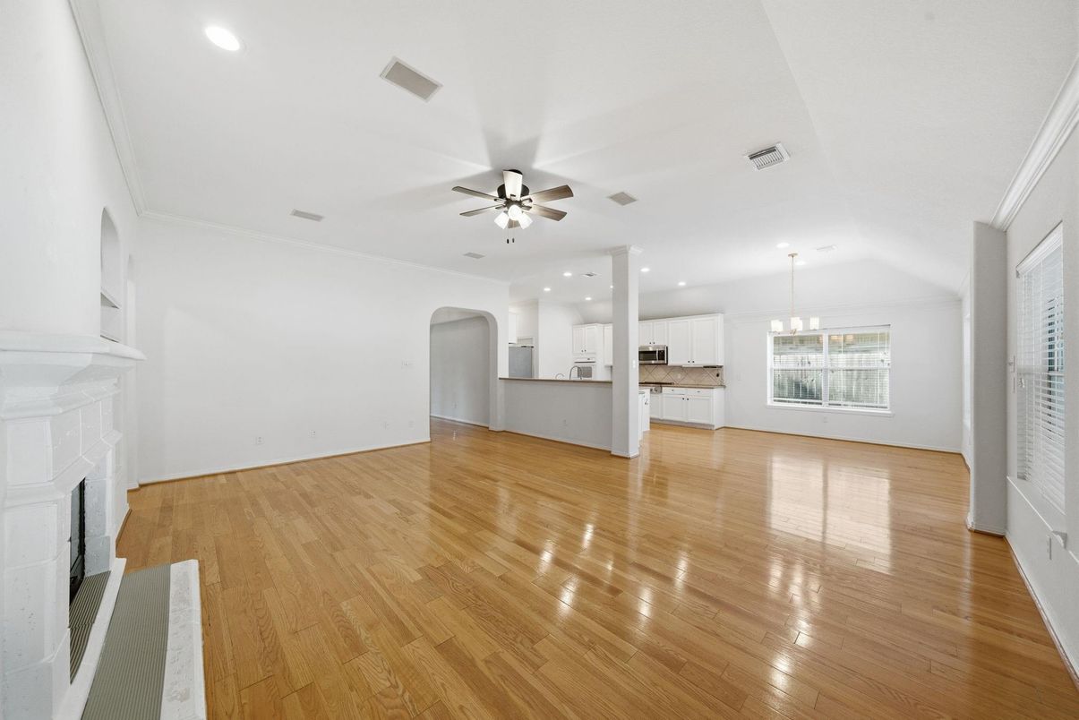 Chandelier, Empty room, Fireplace, Interior, Kitchen, Pendant Lights, Recessed Lighting, Wood Texture Flooring