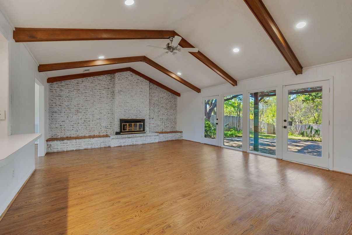 Empty room, Fireplace, Interior, Recessed Lighting, Stone Walls, Wooden Beams, Wood Texture Flooring