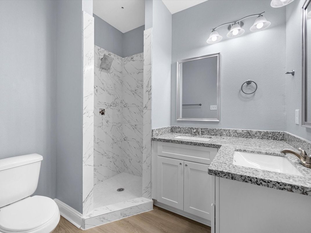 Bathroom, Dual Sink Vanities, Interior, Marble Walls, Wood Texture Flooring