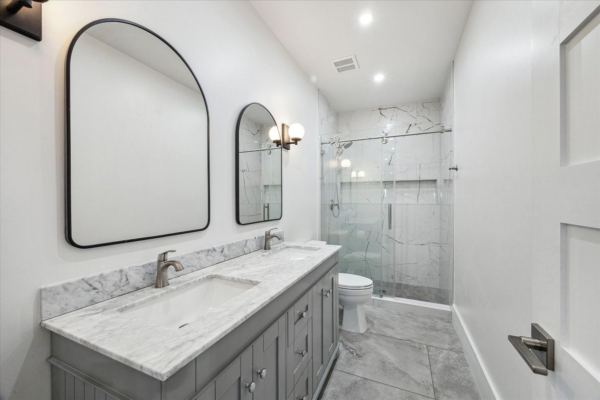 Bathroom, Dual Sink Vanities, Glass Shower, Interior, Marble, Marble Walls, Recessed Lighting