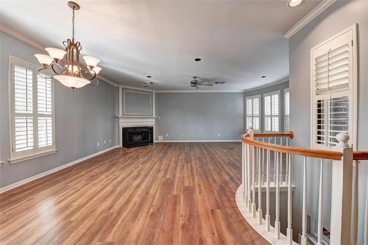 Chandelier, Empty room, Fireplace, Interior, Recessed Lighting, Wood Texture Flooring