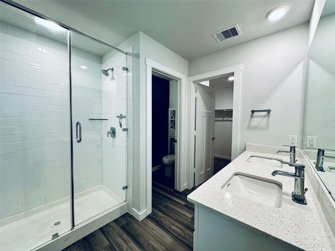 Bathroom, Dual Sink Vanities, Glass Shower, Interior, Recessed Lighting, Wood Texture Flooring