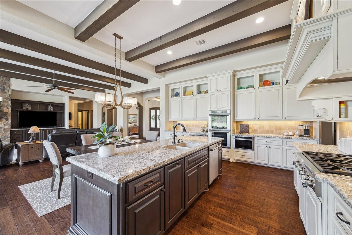 Chandelier, Dining room, Interior, Kitchen, Pendant Lights, Recessed Lighting, Stainless Steel Appliances, Wooden Beams, Wood Texture Flooring