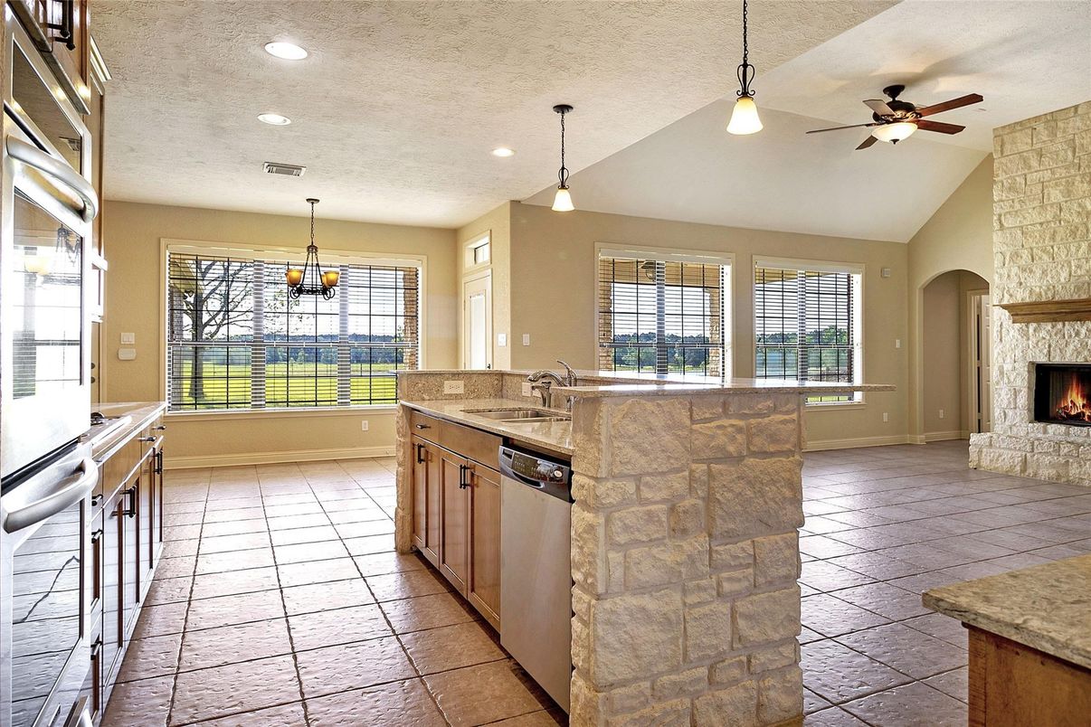 Fireplace, Interior, Kitchen, Pendant Lights, Recessed Lighting, Stone Walls