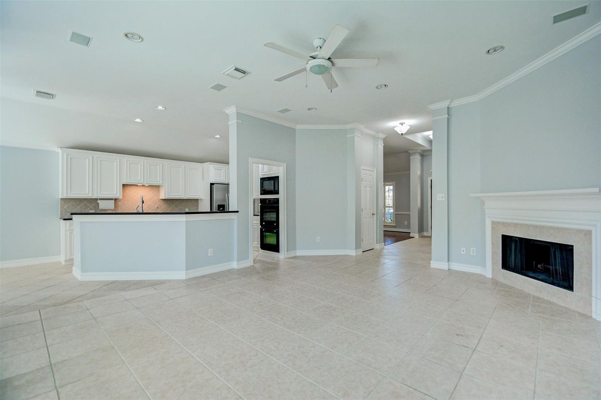 Empty room, Fireplace, Interior, Kitchen, Recessed Lighting, Stainless Steel Appliances