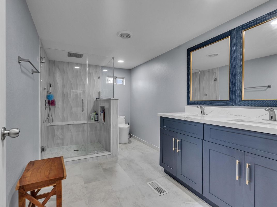 Bathroom, Dual Sink Vanities, Glass Shower, Interior, Marble, Marble Walls, Recessed Lighting