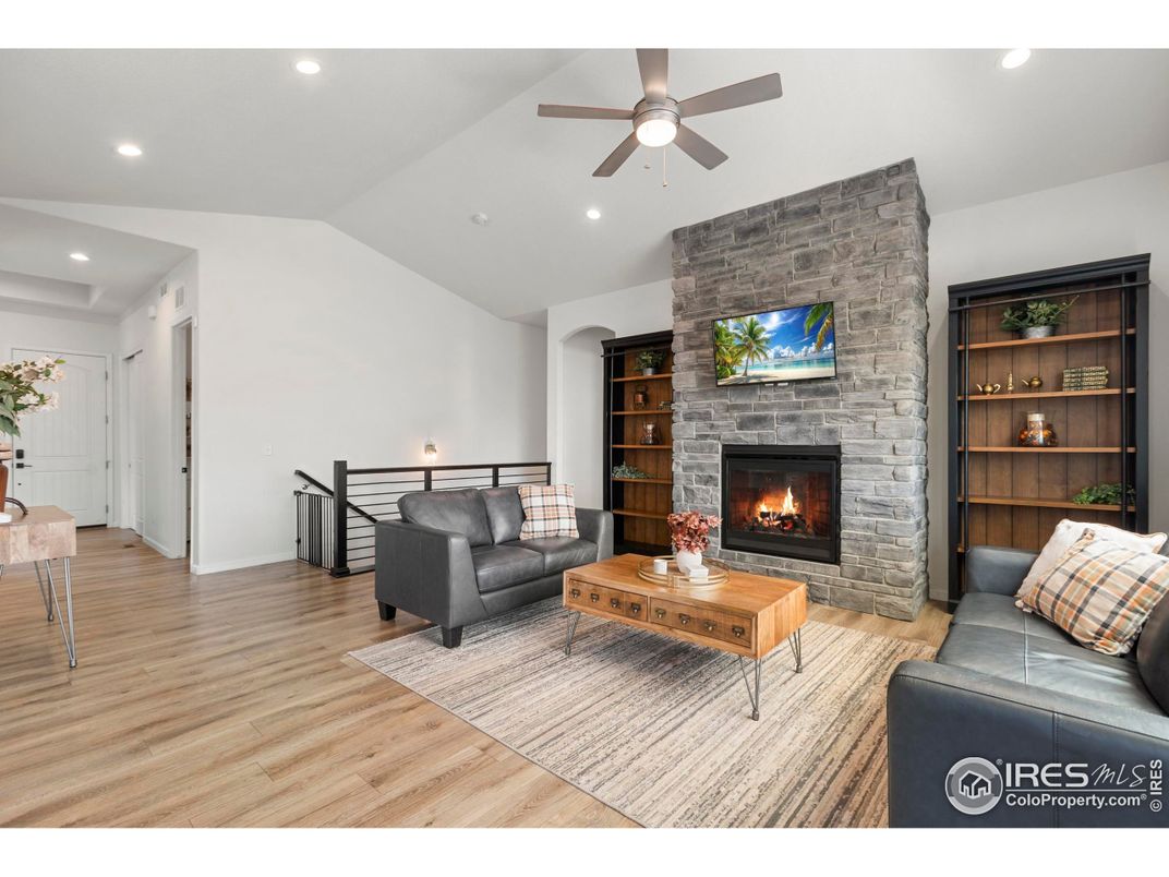 Fireplace, Interior, Living room, Recessed Lighting, Stone Walls, Wood Texture Flooring