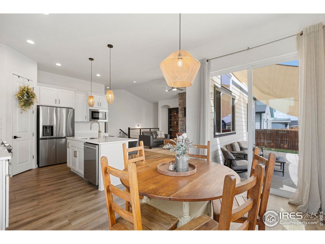 Dining room, Interior, Kitchen, Pendant Lights, Recessed Lighting, Stainless Steel Appliances, Wood Texture Flooring