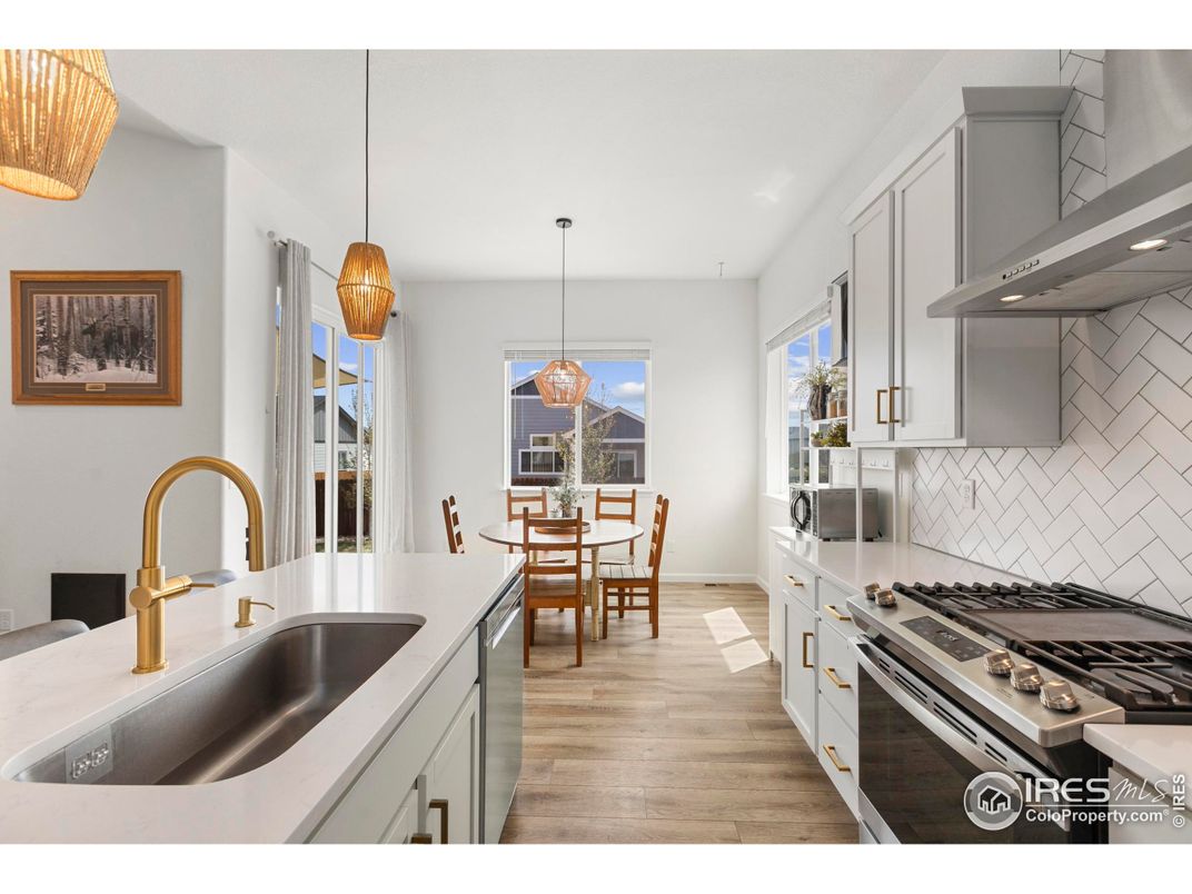 Dining room, Interior, Kitchen, Pendant Lights, Stainless Steel Appliances, Wood Texture Flooring