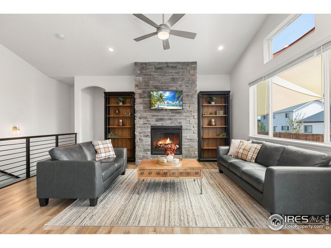 Fireplace, Interior, Living room, Recessed Lighting, Stone Walls, Wood Texture Flooring