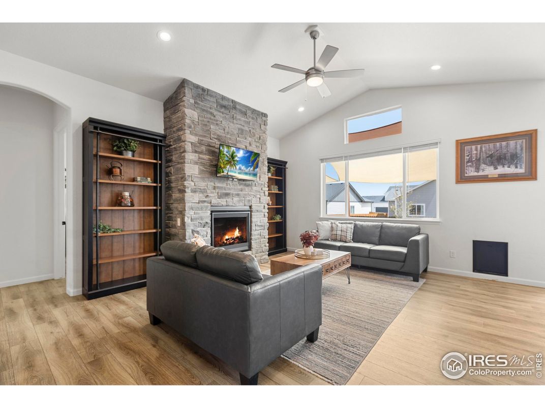 Fireplace, Interior, Living room, Recessed Lighting, Stone Walls, Wood Texture Flooring