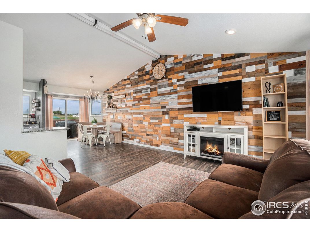 Chandelier, Dining room, Fireplace, Interior, Living room, Recessed Lighting, Stone Walls, Wood Texture Flooring
