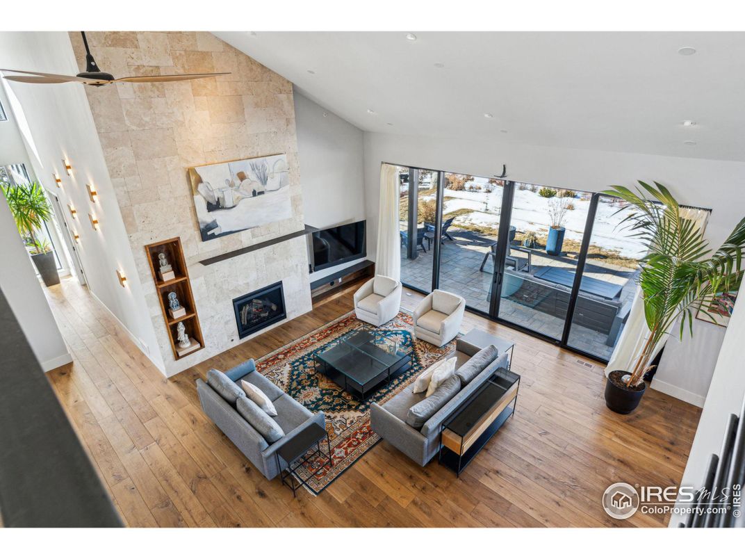 Fireplace, Interior, Living room, Recessed Lighting, Stone Walls, Wood Texture Flooring