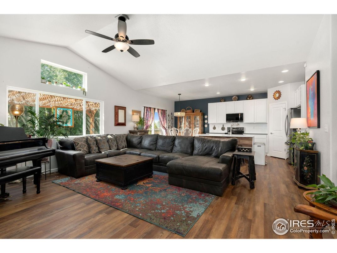 Chandelier, Interior, Kitchen, Living room, Pendant Lights, Piano, Recessed Lighting, Stainless Steel Appliances, Wood Texture Flooring