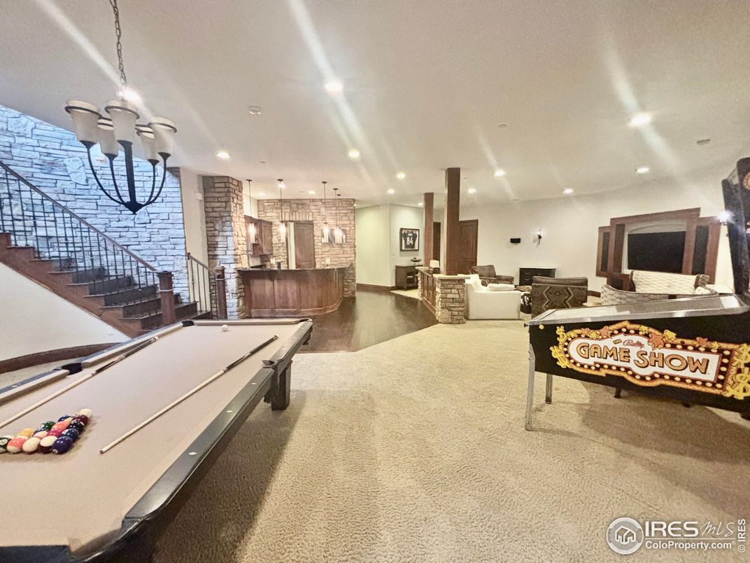 Billiard Table, Chandelier, Game Room, Interior, Living room, Pendant Lights, Recessed Lighting, Wood Texture Flooring